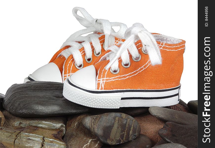 Orange sneakers , standing on stone with white lace. Orange sneakers , standing on stone with white lace