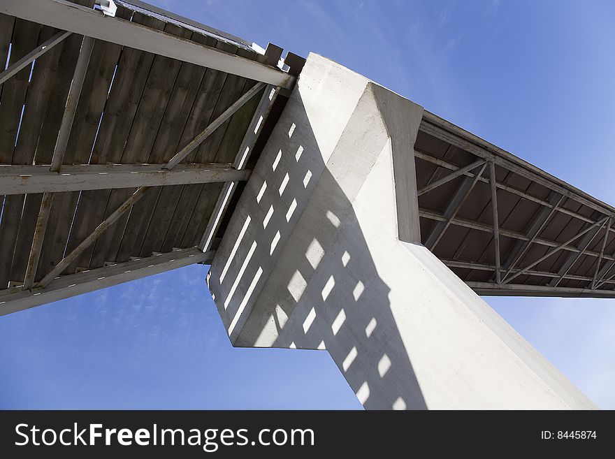 Photo taken under a bridge against clear blue skies. Photo taken under a bridge against clear blue skies.