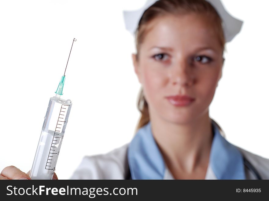 Beautiful nurse with syringe on white background