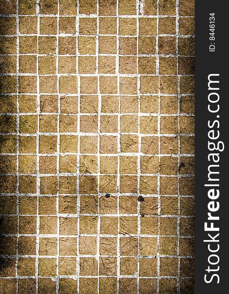 A grungy old mosaic of brown tiles, perfect to use as a background. A grungy old mosaic of brown tiles, perfect to use as a background