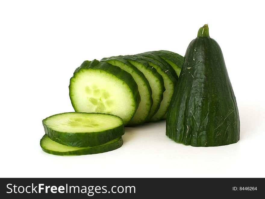 This is a cucumber composition with slices.