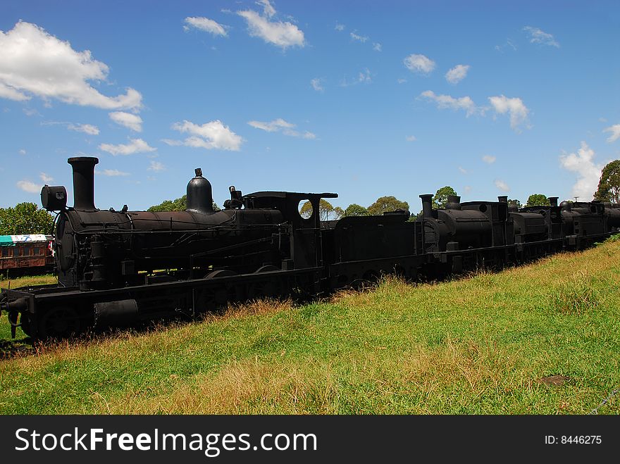 Old steam engines no longer in use linked together