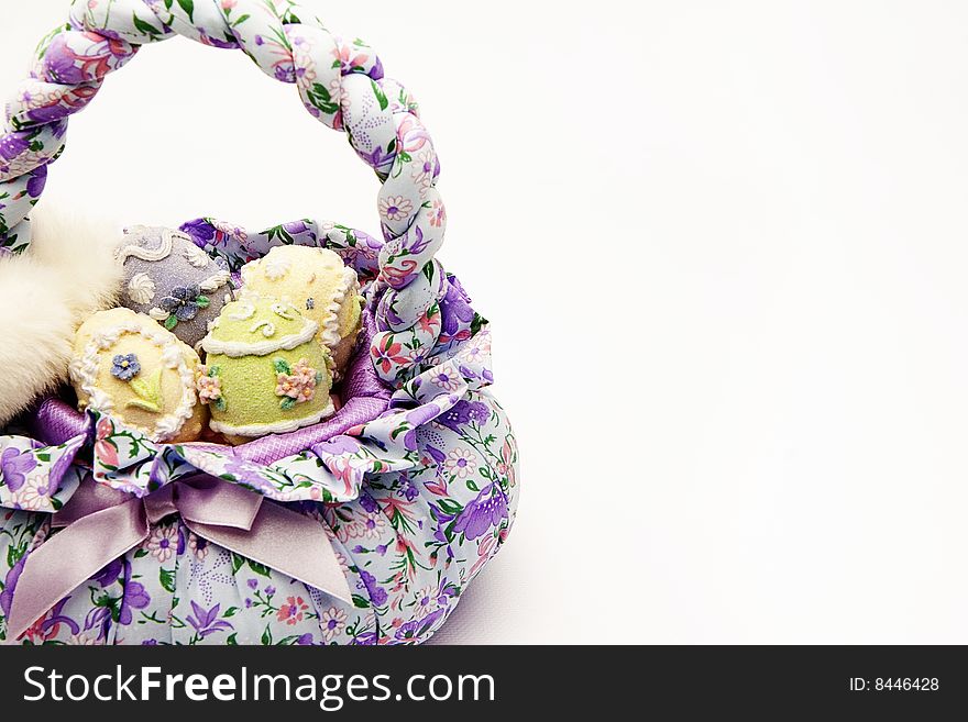 Isolated shot of a basket with easter eggs on white background. Isolated shot of a basket with easter eggs on white background.