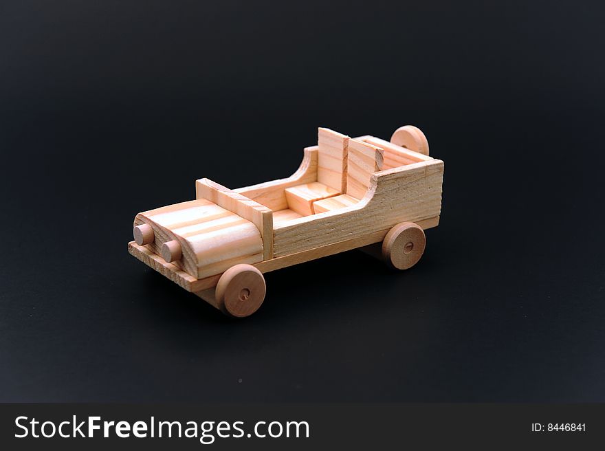 A wood car made by hand.