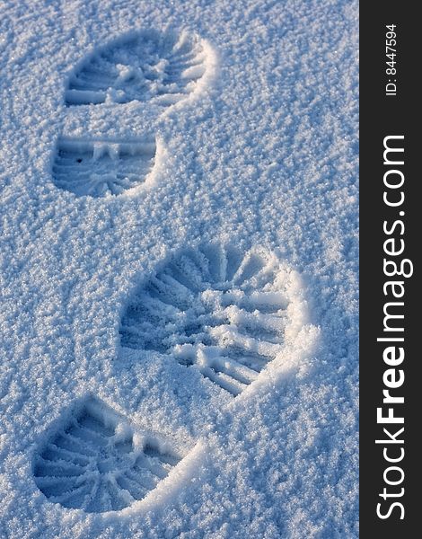 Footprint pair on snow surface