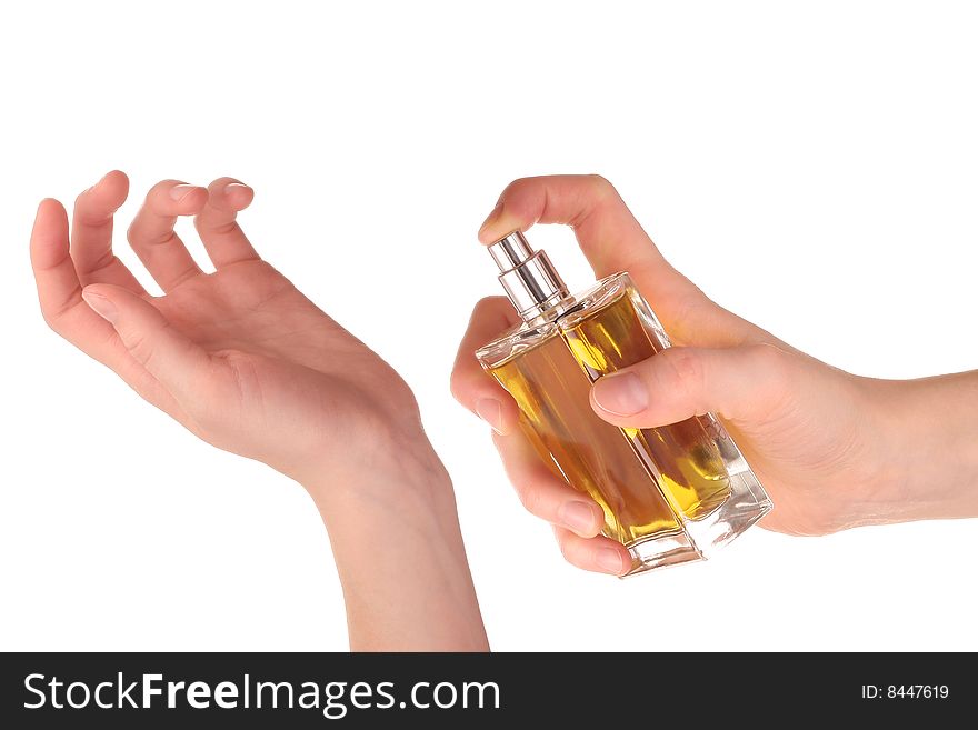 Yellow perfume in hand over white. Yellow perfume in hand over white