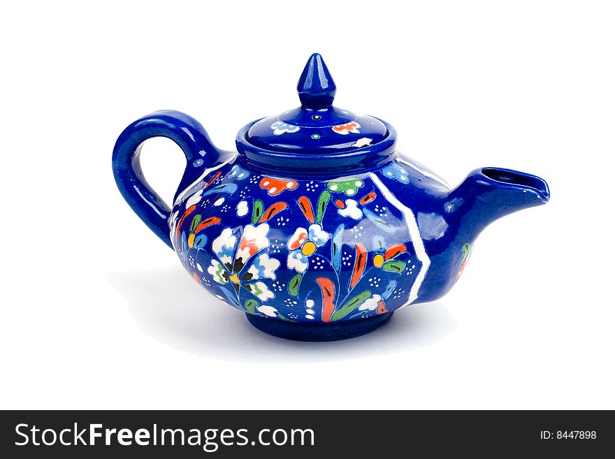 Blue teapot isolated on white.