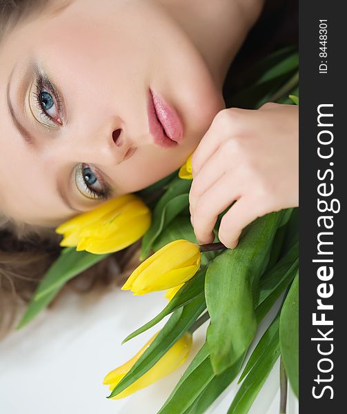 Portrait of beautiful woman with the yellow flowers. Portrait of beautiful woman with the yellow flowers.