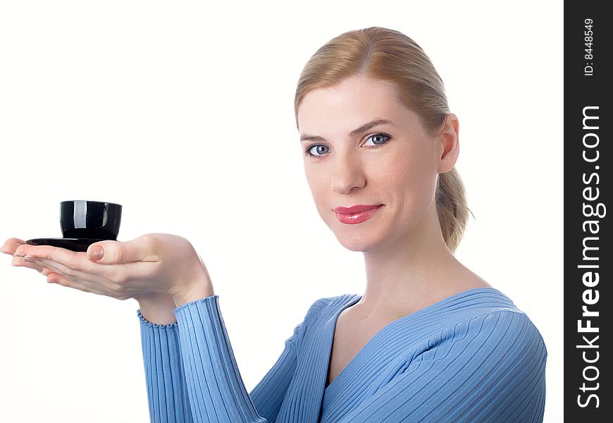 The beautiful girl with a coffee cup in a hand