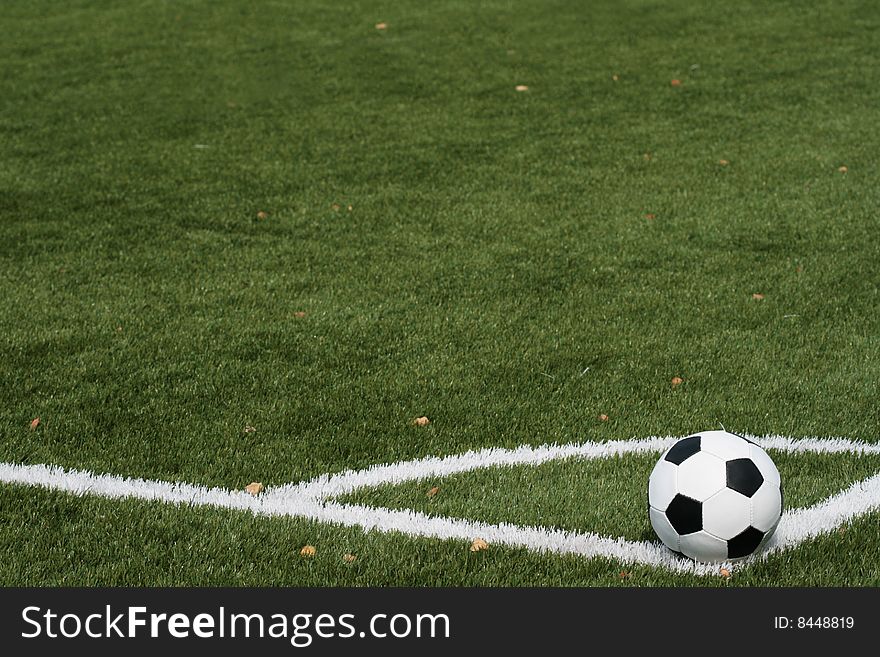 Football in stadium with an artificial covering before the beginning of game.