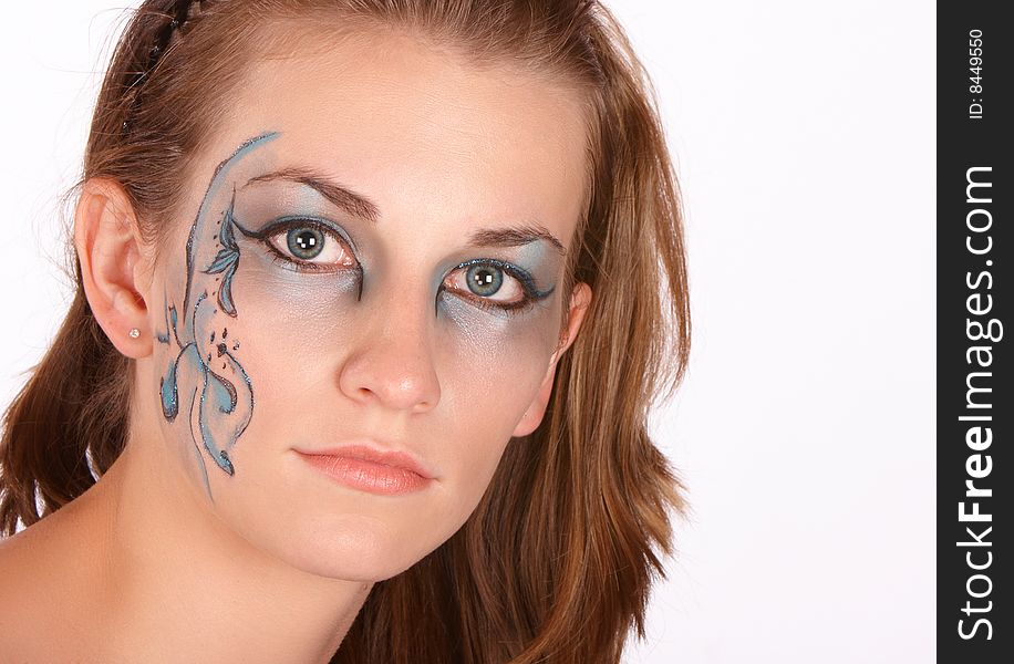 Blue makeup applied on thin brunette with serious look and matching eyes. Blue makeup applied on thin brunette with serious look and matching eyes