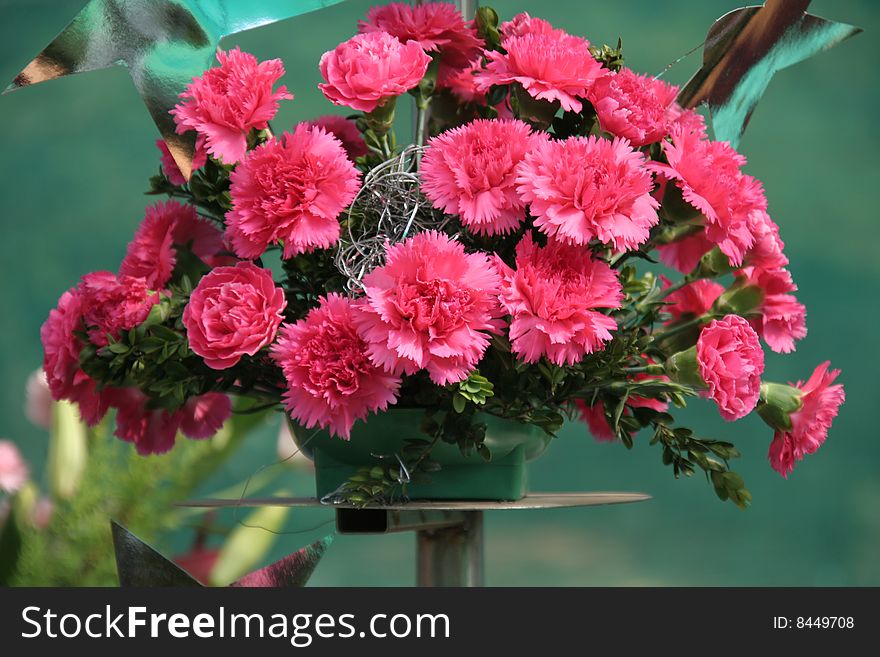 Beautifully bedecked bouquet of pinkish red flowers. Beautifully bedecked bouquet of pinkish red flowers