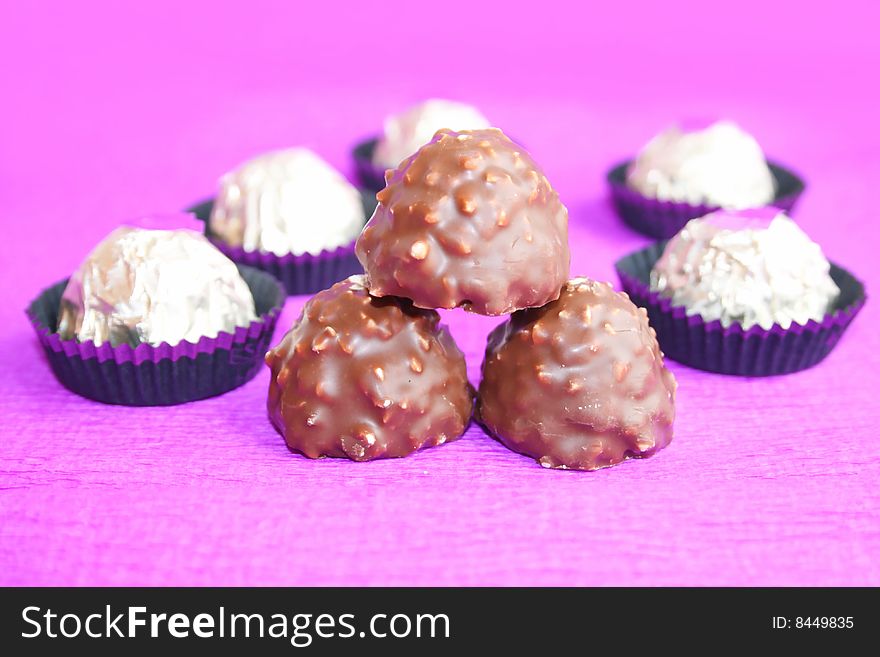 Chocolate candy on a lilac background. Chocolate candy on a lilac background
