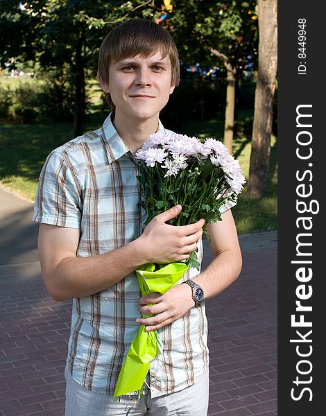 Boy presenting flowers
