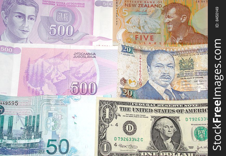 A photo of multiple country currency such as Malaysian Ringgit US Dollar New Zealand 5 Dollar Dinara 500 and Kenya's 20 shillings. A photo of multiple country currency such as Malaysian Ringgit US Dollar New Zealand 5 Dollar Dinara 500 and Kenya's 20 shillings.