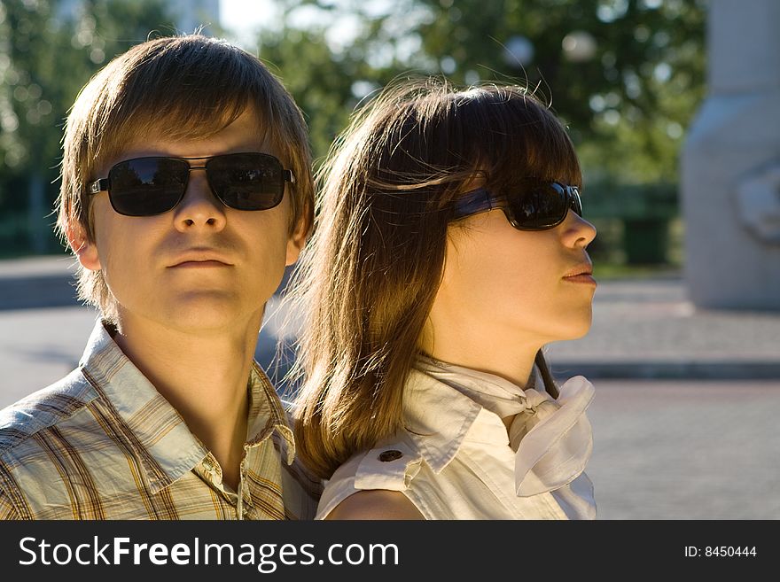 Boy And Girl In Sunglasses Showing How Cool They A