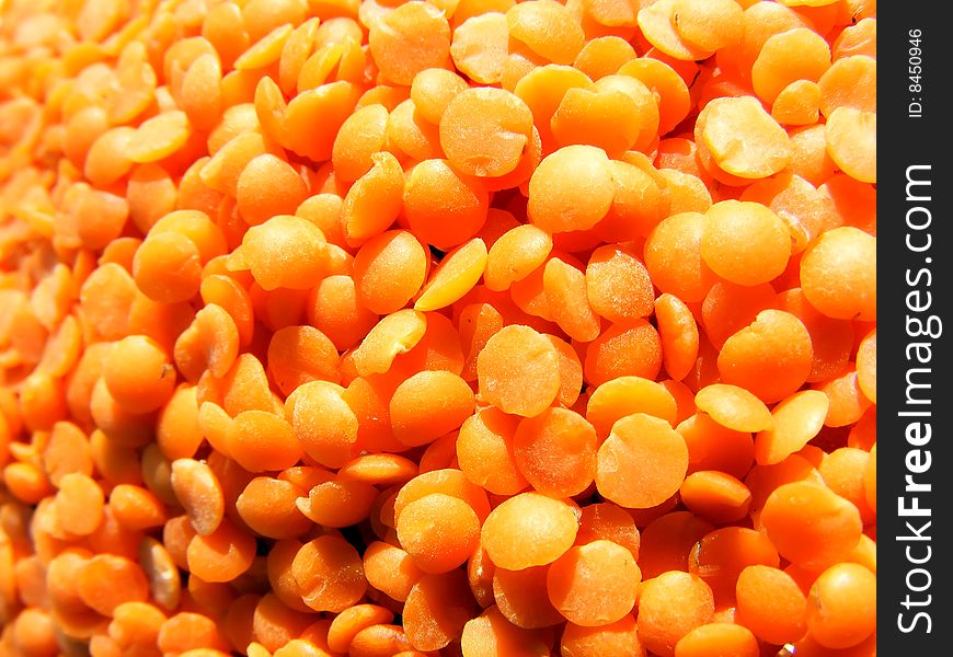 Red lentils background - close up