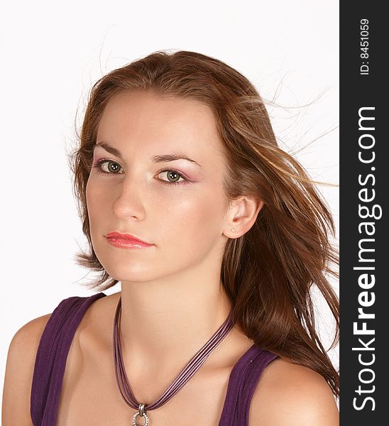 Young female brunette with smooth skin and purple top. Young female brunette with smooth skin and purple top