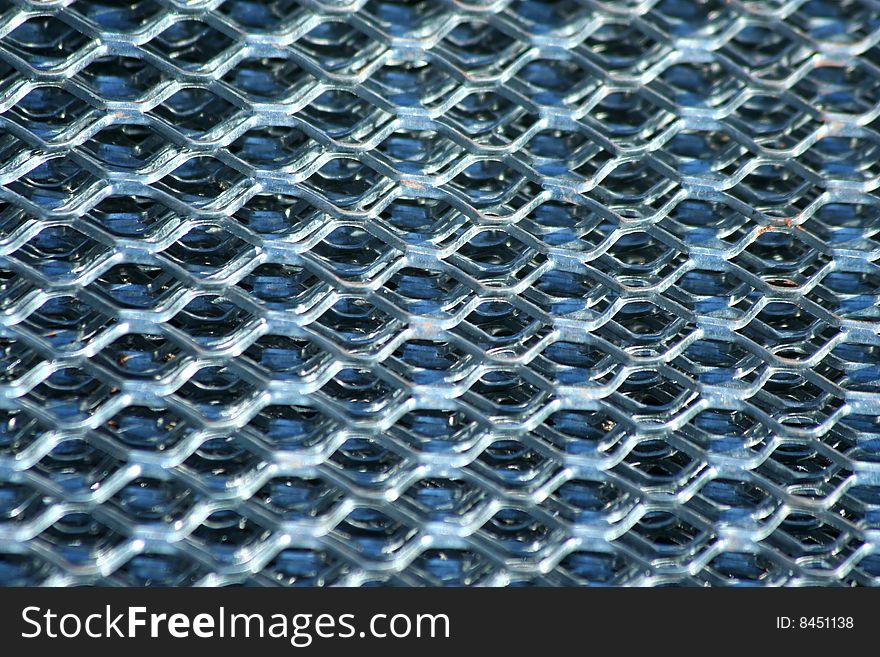 A silver metal fence background