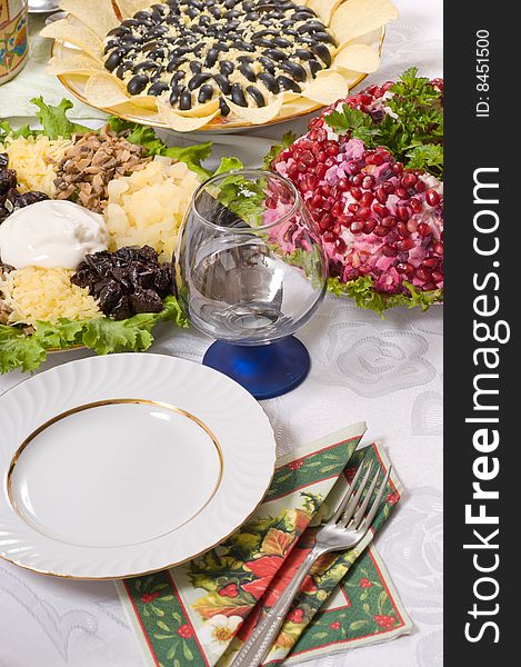 Three kinds of salads, wine glass and tablewares. Three kinds of salads, wine glass and tablewares.