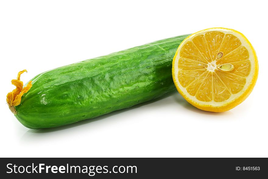 Fresh vegetables (cucumber and sliced lemon) isolated on a white background