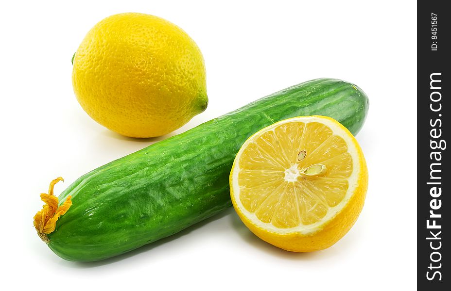 Fresh vegetables (cucumber and sliced lemon) isolated on a white background