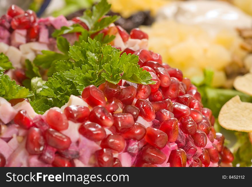 Pomegranate grains decorating salad.