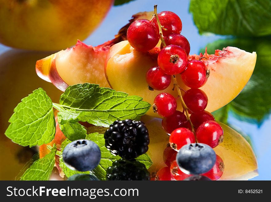 Peach, red currant, blackberry and cranberries in a group