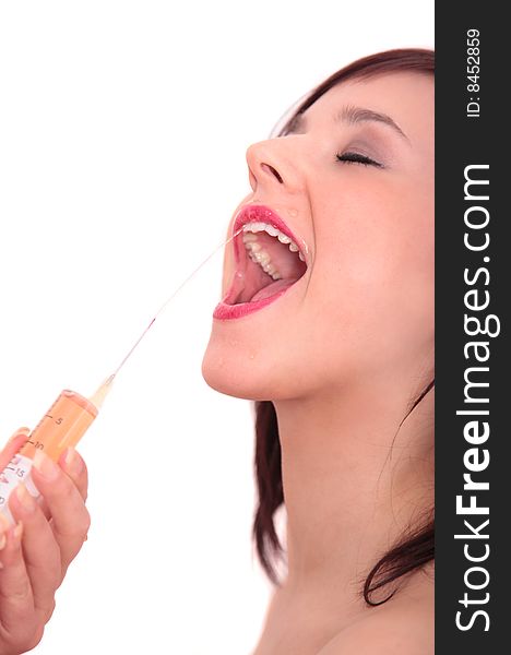 Woman gets mouth shower with injection needle. Woman gets mouth shower with injection needle