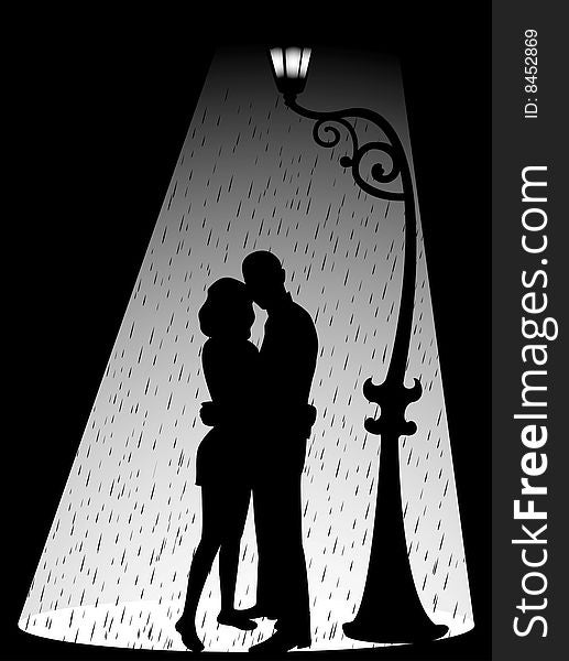 Silhouette of two lovers in the rain