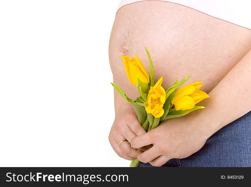 Pregnant woman with yellow tulips