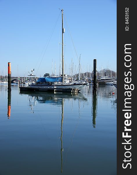 Image of yachts reflected in water. Image of yachts reflected in water