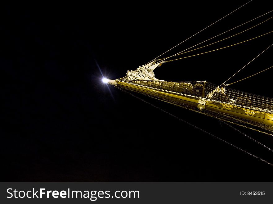 Night view of a bowsprit of a sailing ship wooden overlap with the moon in the background