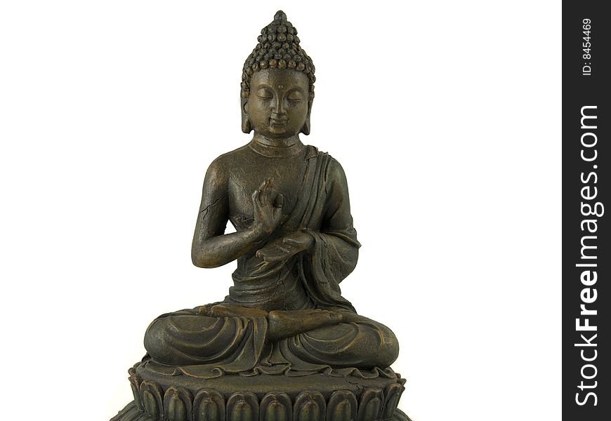A golden buddha statue sits in peaceful meditation. A golden buddha statue sits in peaceful meditation
