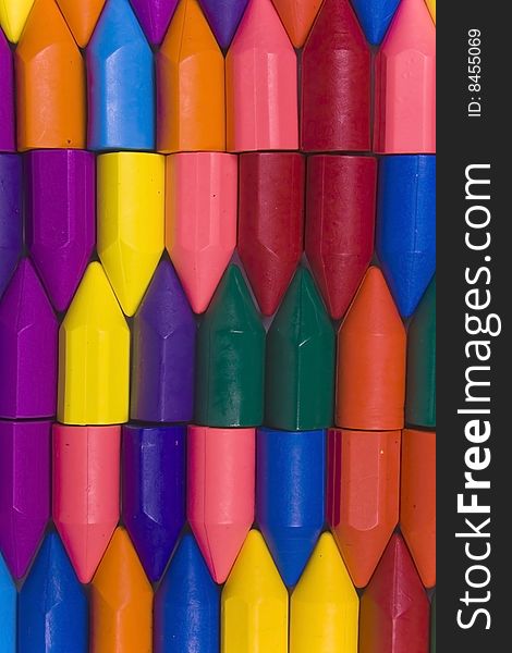 Stacked vertical rows from wax pencils, multicolors. Stacked vertical rows from wax pencils, multicolors