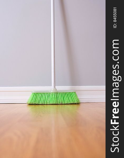 Spring Cleaning broom against wall