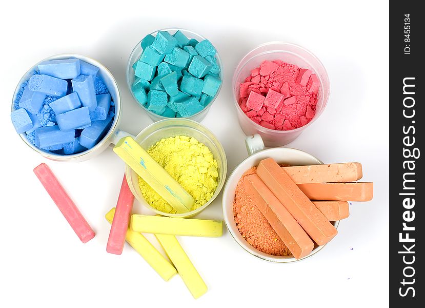 Several colors crushed chalk in tubes and caps