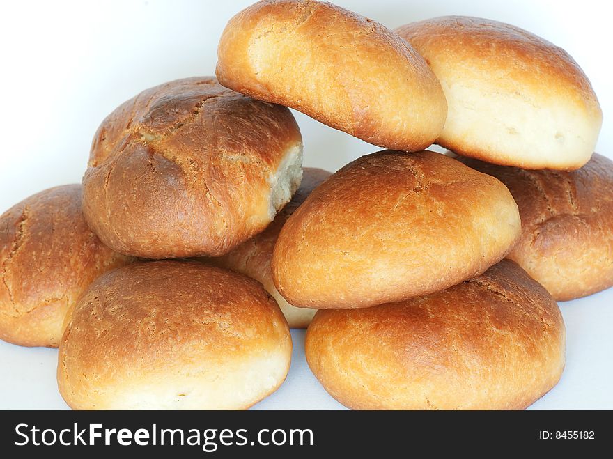 Fresh small bread on a light background. Fresh small bread on a light background