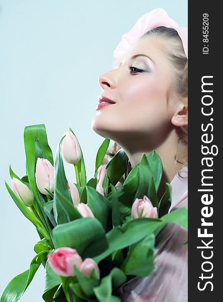Beautiful woman with the bouquet of pink flowers. Beautiful woman with the bouquet of pink flowers.