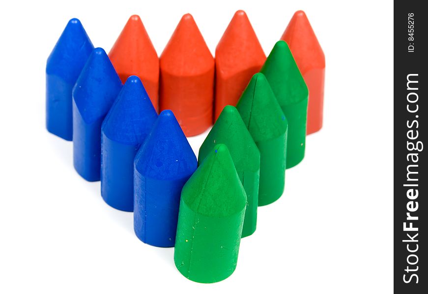 Triangle from red. blue and green wax pencils. Triangle from red. blue and green wax pencils