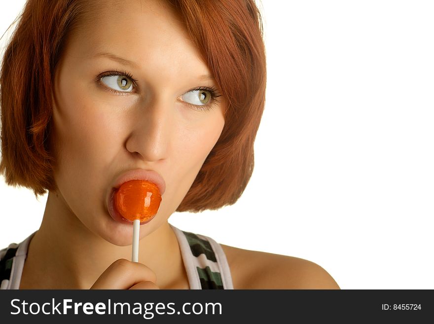 Beautiful young girl with candy on a stick