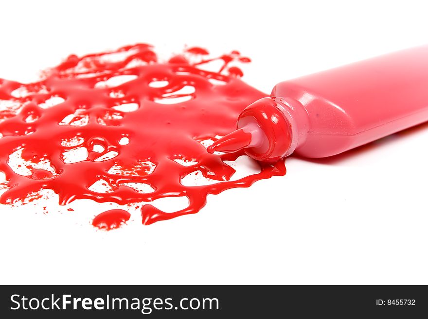 Red blot with tubes on white background