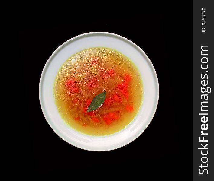 Vegetable soup, isolated on a black background