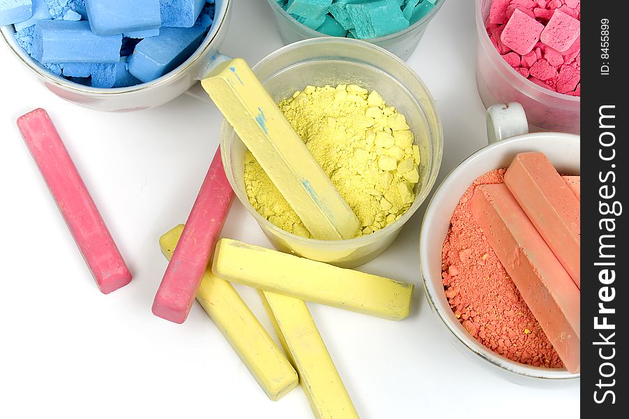 Several colors crushed chalk in tubes and caps