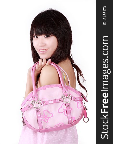 A beautiful Asian girl with pink handbag on white background.