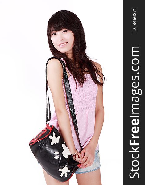 A beautiful Asian girl with handbag on white background. A beautiful Asian girl with handbag on white background.