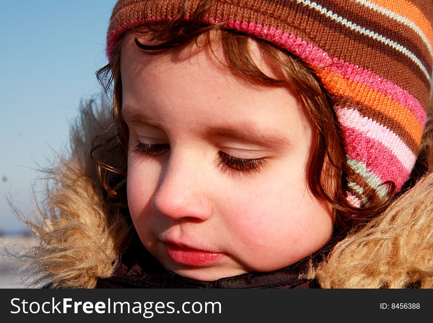 Photo of a young girl in the sunny day
