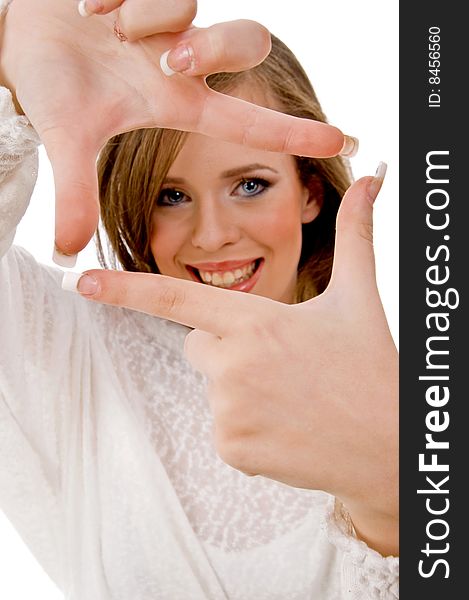 Smiling female showing framing hand gesture