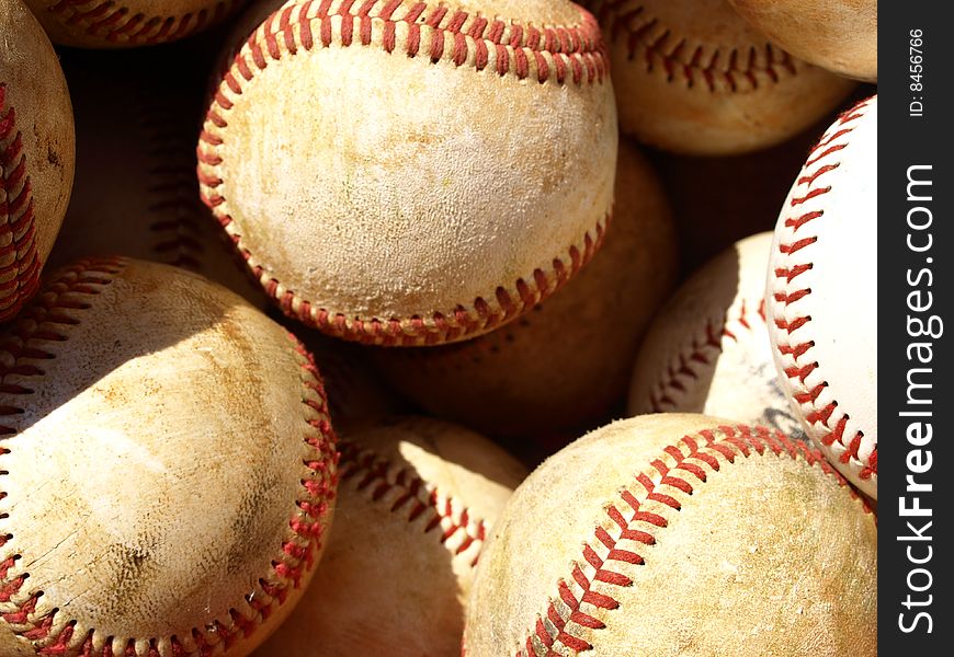 Bucket of old baseballs ready for practice. Bucket of old baseballs ready for practice