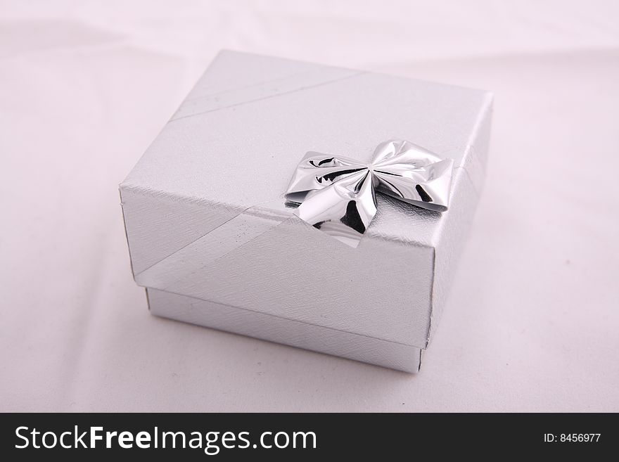 Small cardboard silver colored box for jewelry. Small cardboard silver colored box for jewelry